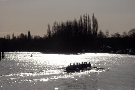 Tree and boat silhouettes on the river at Henley-on-Thames