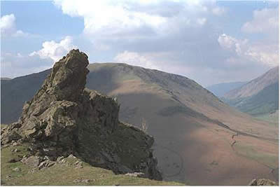 The summit rocks of Helm Crag with Steel Fell behind