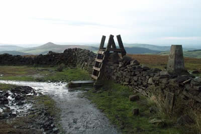 The summit of Shining Tor is marked by a boundary wall