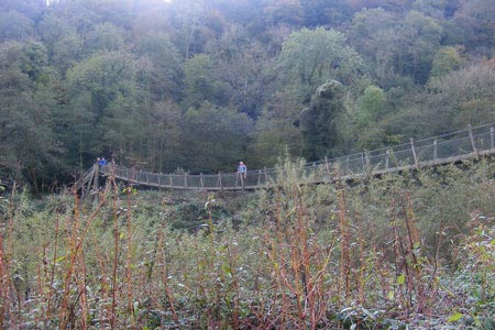 A suspension bridge carries the Wye Valley Way over the Wye