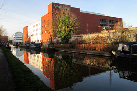 Waitrose at Aylesbury - a near perfect reflection in the Grand Union Canal.